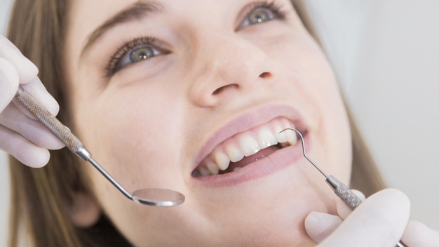 woman having teeth examined at dentists 23 2147879263